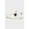 White leather sneakers with patch