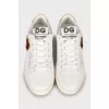 White leather sneakers with patch