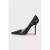 Black snakeskin embossed pumps