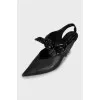 Leather slingbacks with lacquer bow