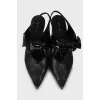 Leather slingbacks with lacquer bow