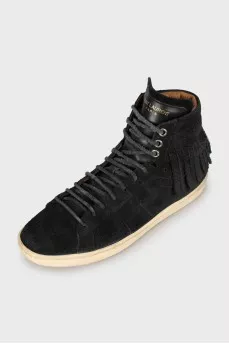 Suede sneakers decorated with fringes