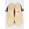Suede sneakers decorated with fringes