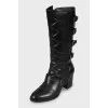 Leather boots decorated with buckles