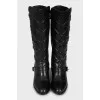 Leather boots decorated with buckles