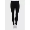 High-waisted black skinny jeans