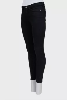 High-waisted black skinny jeans