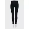 High-waisted black skinny jeans