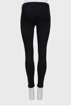 High-waisted black skinny jeans