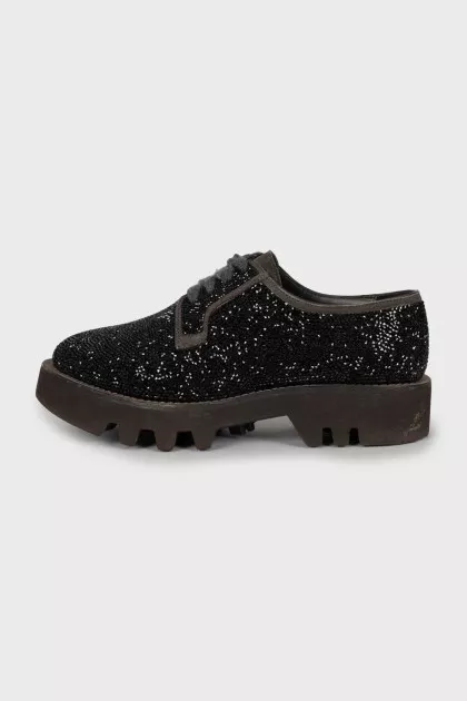 Lace-up shoes decorated with rhinestones