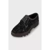 Lace-up shoes decorated with rhinestones