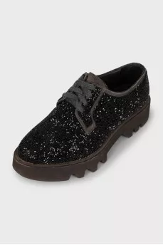 Lace-up shoes decorated with rhinestones