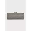 Shiny clutch with gold hardware