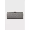 Shiny clutch with gold hardware