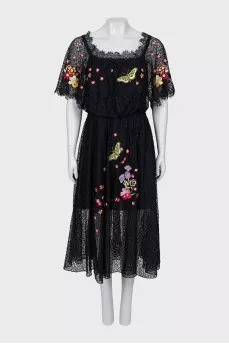 Lace dress decorated with embroidery