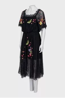 Lace dress decorated with embroidery