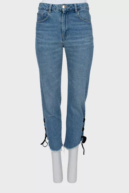 Blue jeans decorated with ties