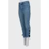 Blue jeans decorated with ties