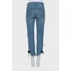Blue jeans decorated with ties
