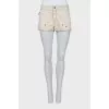 Denim shorts with metallic rhinestones