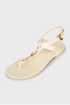 Rubber sandals with gold hardware