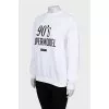 Sweatshirt with black print and tag