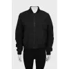 Bomber jacket with draped sleeves