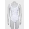 One-piece swimsuit with text print and tag