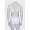 One-piece swimsuit with text print and tag
