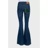Flared jeans decorated with embroidery