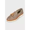 Leather shoes with perforations and fringes
