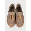 Leather shoes with perforations and fringes