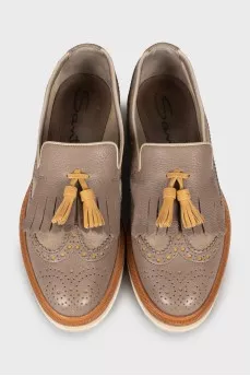 Leather shoes with perforations and fringes