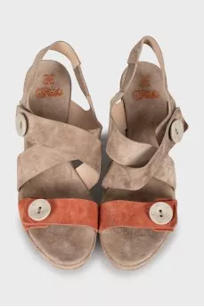 Suede sandals decorated with buttons