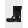 Rubber boots decorated with spikes