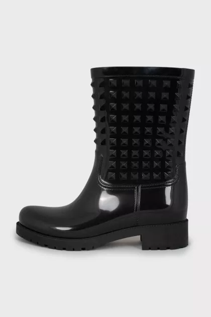 Rubber boots decorated with spikes