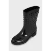 Rubber boots decorated with spikes