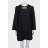 Black dress with gold logo