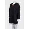 Black dress with gold logo