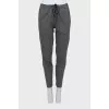 Tapered gray trousers with pockets