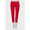 Cropped red trousers with arrows