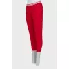 Cropped red trousers with arrows