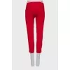 Cropped red trousers with arrows