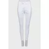 Tapered white trousers with arrows