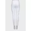 Tapered white trousers with arrows