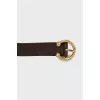 Brown belt with gold buckle