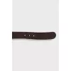 Brown belt with gold buckle