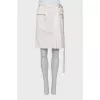 Skirt with patch pockets and tag
