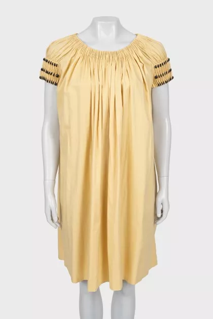 A-line dress with draping and tag