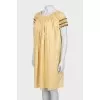A-line dress with draping and tag